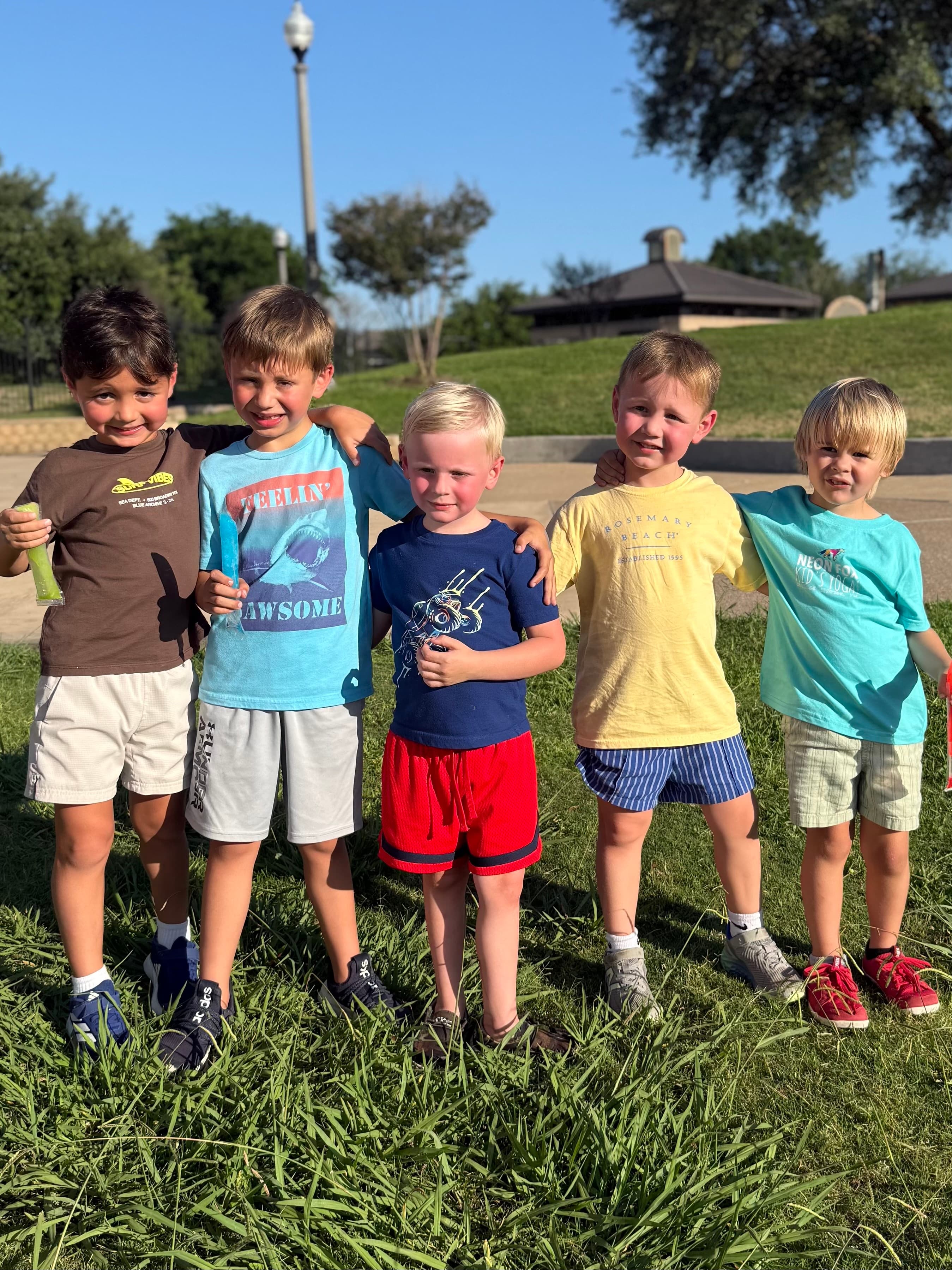 Kids enjoying popsicles after yoga class at the park